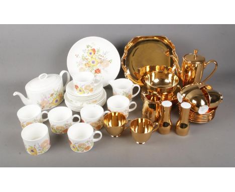 A Wedgwood Summer Bouquet tea service and Noritake gold coffee service. Sets include coffee pot, tea pot, salt and pepper sha