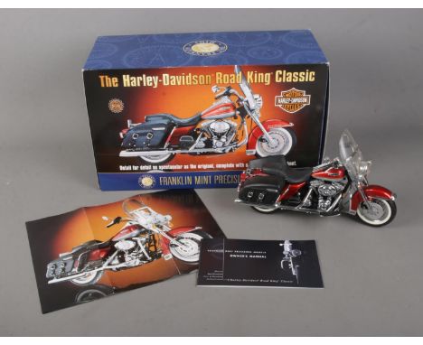 A boxed Franklin Mint 1:10 scale diecast model of The Harley Davidson Road King Classic.  