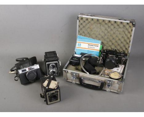 A collection of vintage cameras to include Rollop Enna, cased Praktica B200, Brownie Model C and Halina Paulette.  
