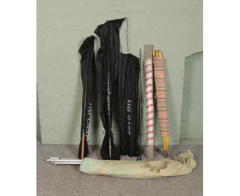 Three modern Tri-Cast fishing rods along with Poulard Ropemaker Tent and two vintage windbreakers.  