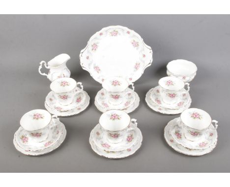 A Royal Albert tea six person tea service in the Tranquility pattern to include cake plate, sugar bowl and milk jug. Approx. 