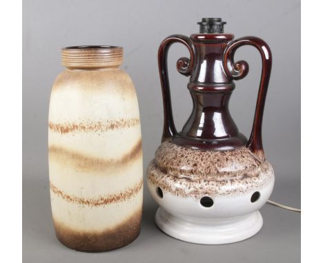 A large West German pottery vase (38cm) along with a similar twin handled table lamp.  