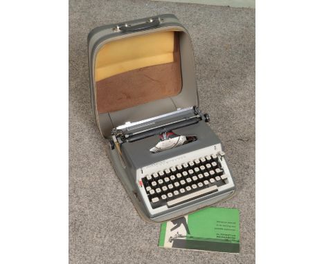 A 1960s Remington Monarch portable typewriter.  