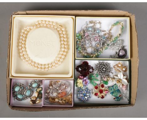 A tray of assorted costume jewellery to include boxed Monet pearl necklace, brooches, necklaces, clip earrings, etc.  