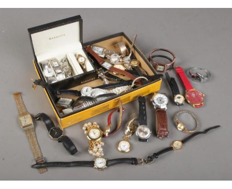 A box of ladies and gents quartz and manual wristwatches. Includes Sekonda, Lorus, Timex etc.  