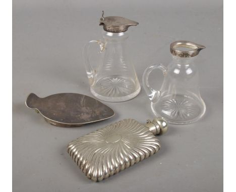 A collection if silver and white metal including two glass jugs with silver rims and a white metal hip flask and Asprey Londo