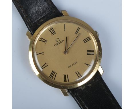 A gents gold plated Omega De Ville manual wristwatch.  Not running. Doesn't wind.