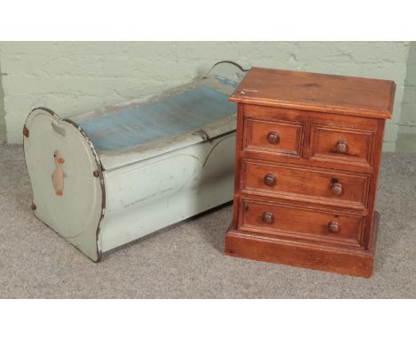 A vintage tin toy trunk produced by Northampton Metal Crafts Company together with a small pine chest of drawers  