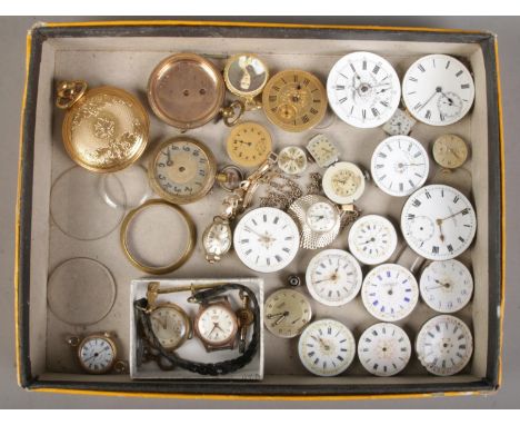 A tray of watch parts. Includes pocket and fob watch movements, ladies manual watch heads; Roamer and Lanco etc.  