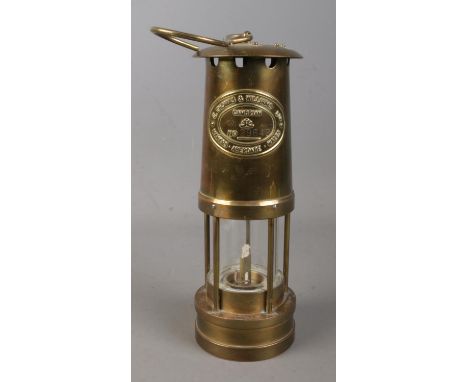 A Welsh brass miners lamp by E Thomas &amp; Williams Ltd.  