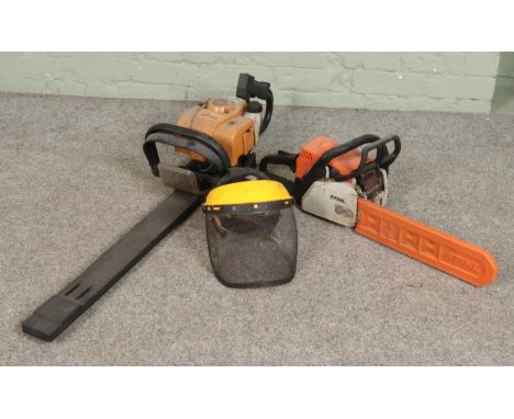 A Stihl petrol chainsaw along with a Tivoli 63 petrol hedge trimmer and Rocwood safety visor.  