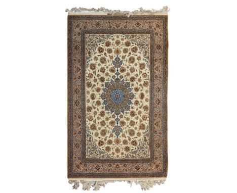ISFAHAN PART SILK CARPET  CENTRAL PERSIA, MID/LATE 20TH CENTURY   the cream field with beige and blue medallion, within beige