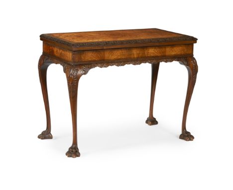 GEORGE II STYLE FIGURED WALNUT CARD TABLE, BY MAPLE & CO.  20TH CENTURY   the pivoting fold-over top with a foliate carved mo