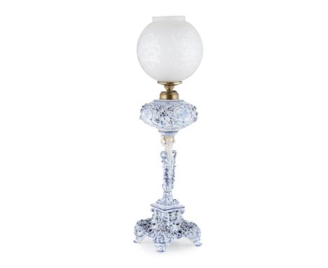 GERMAN BLUE AND WHITE PORCELAIN OIL LAMP  LATE 19TH/EARLY 20TH CENTURY   with an acid-etched glass globe above a globular res