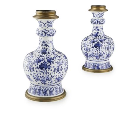 PAIR OF FRENCH BLUE AND WHITE LAMP BASES  20TH CENTURY   in the Chinese garlic-mouth bottle style, decorated with scrolling f