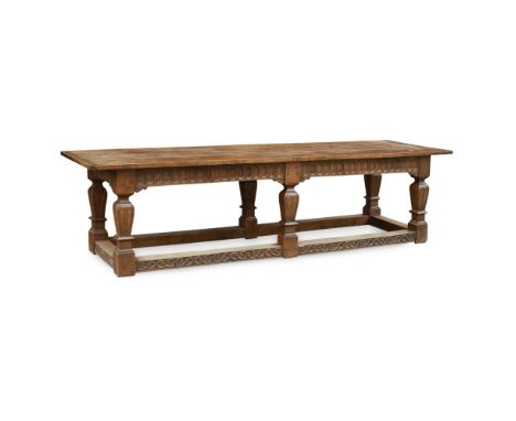 LARGE OAK REFECTORY TABLE  20TH CENTURY   in the 17th century style, the long five board cleated top over an arch carved frie