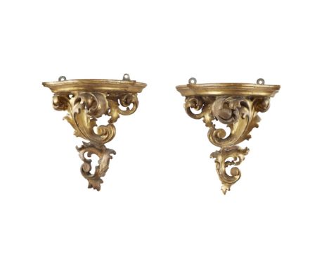 TWO PAIRS OF GILTWOOD WALL BRACKETS  19TH CENTURY   the larger pair with a curved shelf on a foliate support, 34cm high, 25cm