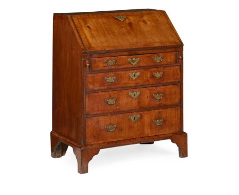 GEORGE II SMALL WALNUT BUREAU  EARLY 18TH CENTURY   the feather and crossbanded slant front opening to an interior fitted wit