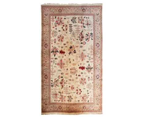 NORTHWEST PERSIAN STYLE CARPET  MODERN   the cream field with allover stylised palmette and vine pattern, within grey turtle 