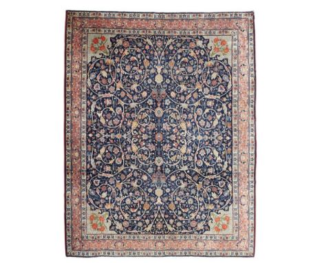 BENLIAN TABRIZ CARPET  NORTHWEST PERSIA, EARLY 20TH CENTURY   the indigo field with allover scrolling arabesques with animal 