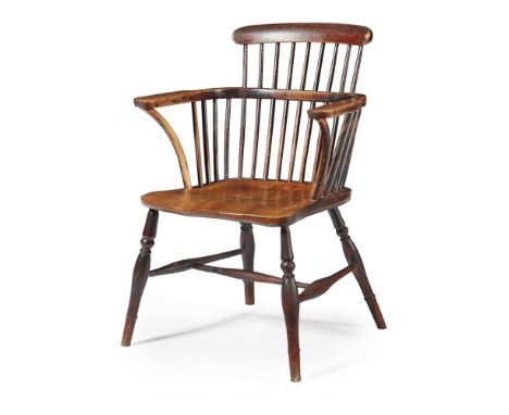 ASH AND ELM LOW COMB-BACK WINDSOR ARMCHAIR  19TH CENTURY   with a shaped seat and turned legs joined by a turned H stretcher 
