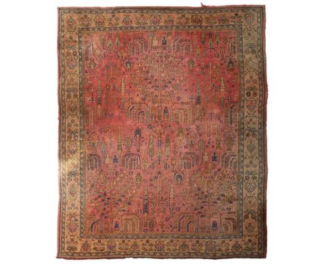 USHAK CARPET  WEST ANATOLIA, LATE 19TH CENTURY   the pink field with allover tree pattern, within camel palmette and floral b