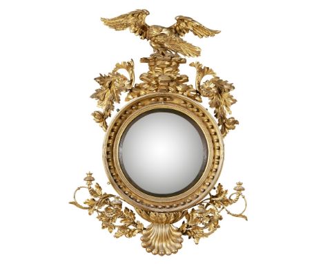 LARGE REGENCY GILTWOOD CONVEX GIRANDOLE MIRROR  EARLY 19TH CENTURY   the convex mirror plate in an ebonised slip and moulded 