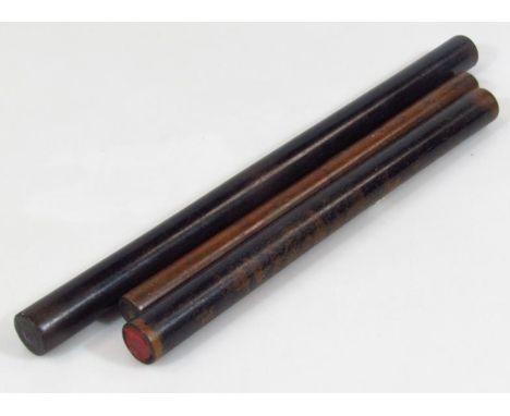 A cylindrical ebonised stick, possibly a cosh or swagger stick, with turned end, 40cm long, and two others similar. (3)