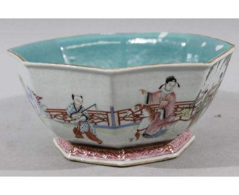 A Chinese porcelain Tongzhi period bowl, of octagonal outline with turquoise interior and underside, the body decorated with 