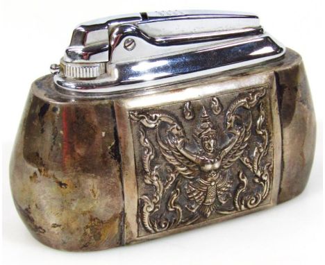 A Ronson table lighter, with an elaborate raised panel to either side, decorated with god, marked beneath Siam Sterling, whit