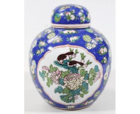 A Chinese late Qing period semi-porcelain ginger jar, of circular form with compressed circular lid, heavily decorated with p