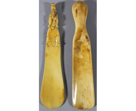 Two Chinese ivory scoops, with elaborate figural handles, 20cm high, first quarter of the 20thC. The vendor can trace these i