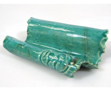 A Chinese pottery pen rest, in green glazes with seal style Tang horse, naively cast with a double scroll outline, unmarked, 