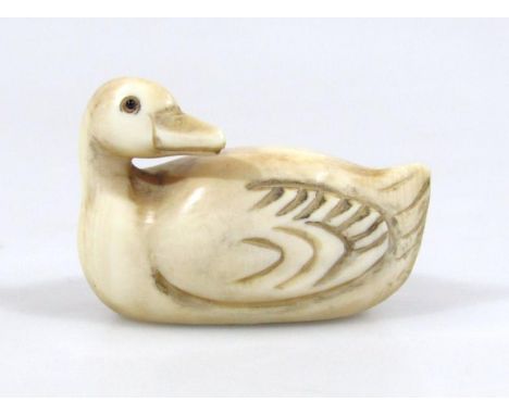 A early 20thC ivory netsuke, formed as a goose with part textured wings, double drill holes beneath numbered 3/70, 4cm wide. 