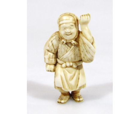 A Japanese Meiji period netsuke, formed as a lady dressed in finery with drill hole to the back, unsigned, 7cm high.