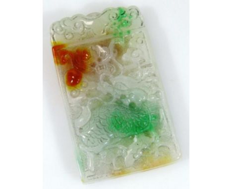 A tri-colour jade pendant carving, the rectangular body raised with dragons, scrolls and flowers, in green, fawn and orange f