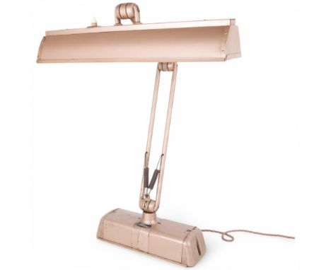A mid 20th century Spotline industrial desk lamp, with adjustable stem and shade, makers label, height approx 70cmPitting and