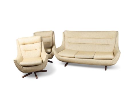 A 1970s' Parker Knoll Ambassador 3 piece suite, with 3 seat sofa and 2 swivel egg chairs on teak bases, re-upholstered in bei