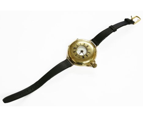 An 18ct gold half hunter pocket watch, later converted to a strap watch, white enamel dial and Roman numerals, lower carat wi