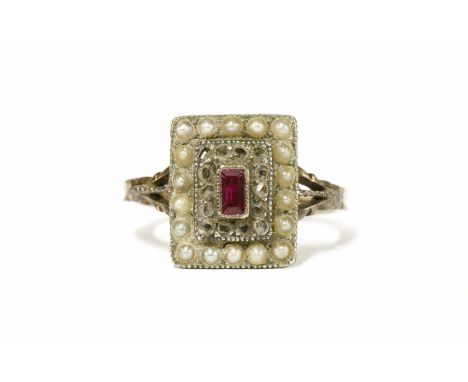 A gold baguette cut synthetic ruby, rose cut diamond and split pearl rectangular cluster ring, with trifucated shoulders to a