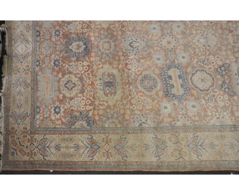 A Persian carpet, cream ground. 515 x 406cm