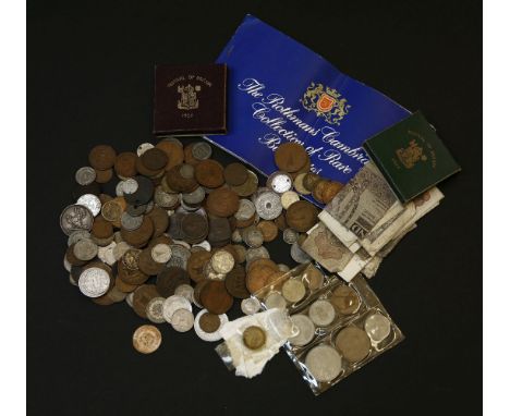 A collection of coins to include commemorative crowns, British world coins including silver examples, etc, and a collection o