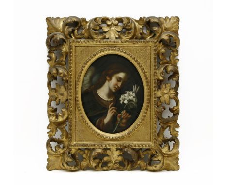 Italian School PORTRAIT OF A LADY HOLDING A FLOWER oil on board, oval, in Florentine frame panel, 22 x 17cm