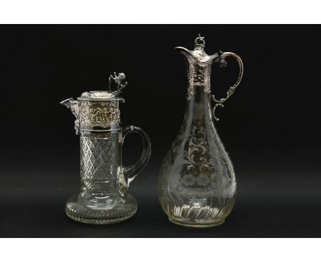 A cut glass claret jug with silver plated mounts, 36cm high, and one other similar, 29cm high