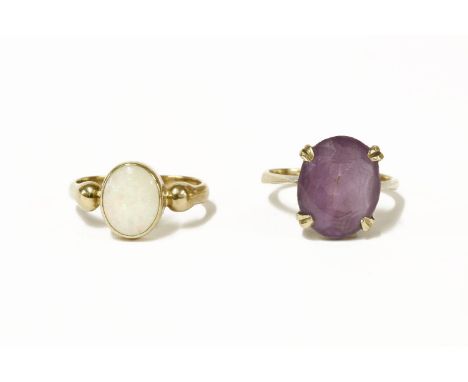 A gold single stone amethyst ring, four claw set to a plain polished shank, size L½,  and a 9ct gold single stone rub set opa