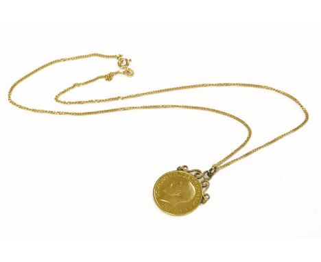 A sovereign pendant, coin dated 1915, with hand soldered, milled wire scroll top mount, suspended on a 9ct gold filed curb ch