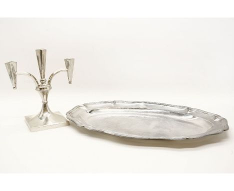 A Continental silver serving platter, together with a Continental silver three branch candelabrum, approximately 54 ozs