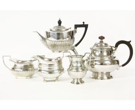 A George V silver teapot and a silver milk jug, Richard Woodman Burbridge for Harrods, Birmingham, 1932, plain with stylised 