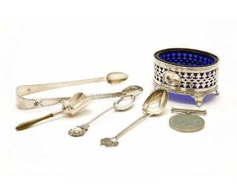 A hallmarked silver salt with blue glass liner, together with a small collection of silver flatware, a silver plated part can