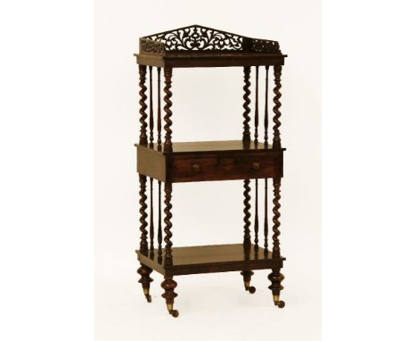 A Victorian three shelf rosewood whatnot, with gallery, drawer and twist columns. Paper label: 'From W. Johnson's Cabinet, Up